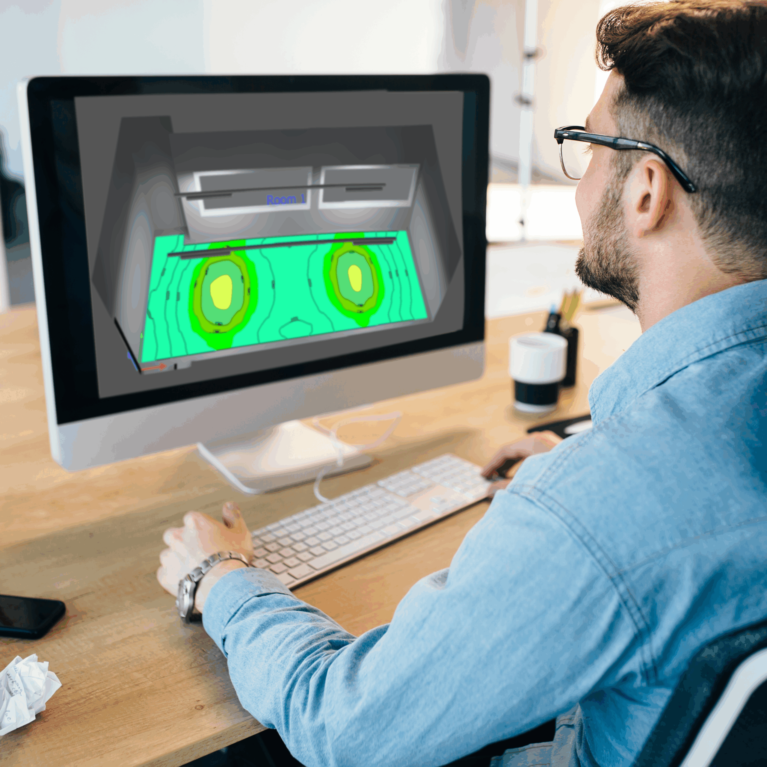 Mann arbeitet am Computer und erstellt einen 3D-Plan als Teil einer professionellen technischen Planungsdienstleistung